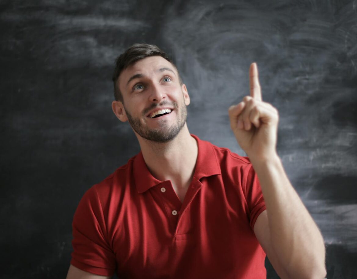 A man pointing up and talking to himself loud A man pointing up and talking to himself loud